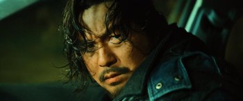 Movie still from “A Writer's Odyssey” (2021), directed by Yang Lu – A person with long hair; Close Up shot, Low angle