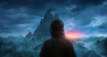 Movie still from “A Writer's Odyssey” (2021), directed by Yang Lu – A man standing in front of a mountain at sunset; Extreme Wide shot, Over the shoulder angle
