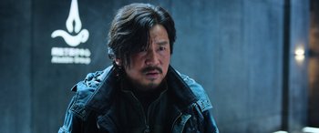 Movie still from “A Writer's Odyssey” (2021), directed by Yang Lu – A person wearing a leather jacket; Close Up shot, Low angle