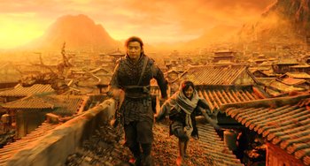 Movie still from “A Writer's Odyssey” (2021), directed by Yang Lu – A man and a woman are walking on a roof top; Wide shot, Low angle