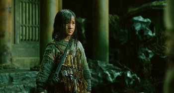 Movie still from “A Writer's Odyssey” (2021), directed by Yang Lu – A young girl dressed as a medieval soldier; Medium shot, Low angle