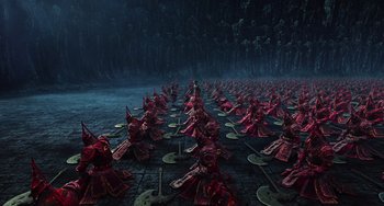 Movie still from “A Writer's Odyssey” (2021), directed by Yang Lu – A large group of people dressed in red; Extreme Wide shot, High angle