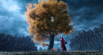 Movie still from “A Writer's Odyssey” (2021), directed by Yang Lu – A person standing in front of a large tree; Extreme Wide shot, Low angle