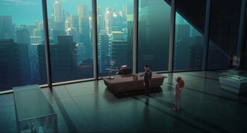 A man and a little girl are in a room with large windows