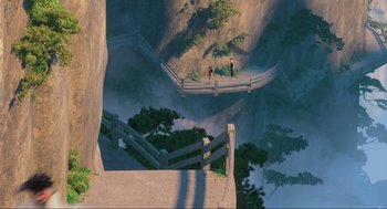 Movie still from “Abominable” (2019), directed by Todd Wilderman – A couple of people standing on top of a wooden bridge; Extreme Wide shot, High angle