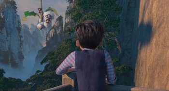 Movie still from “Abominable” (2019), directed by Todd Wilderman – A boy is looking at a monkey on a mountain; Extreme Wide shot, Over the shoulder angle
