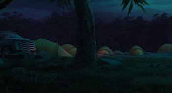 Movie still from “Abominable” (2019), directed by Todd Wilderman – Many tents in the woods at night time; Extreme Wide shot, High angle