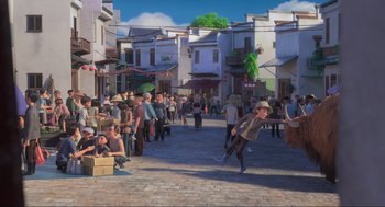 Movie still from “Abominable” (2019), directed by Todd Wilderman – A crowd of people walking down a street; Extreme Wide shot, High angle