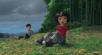 Movie still from “Abominable” (2019), directed by Todd Wilderman – A boy and a girl sitting on the grass; Wide shot, High angle