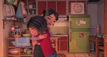 Movie still from “Abominable” (2019), directed by Todd Wilderman – Two people hugging in a kitchen with a refrigerator; Medium shot, Over the shoulder angle