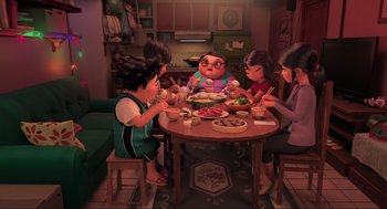 Movie still from “Abominable” (2019), directed by Todd Wilderman – A group of people sitting around a table eating food; Wide shot, High angle