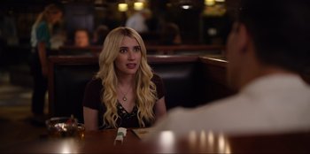 Movie still from “About Fate” (2022), directed by Marius Vaysberg – A woman sitting at a table in front of a man; Close Up shot, Over the shoulder angle