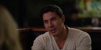 Movie still from “About Fate” (2022), directed by Marius Vaysberg – A person sitting in a room; Close Up shot, Over the shoulder angle