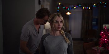 Movie still from “About Fate” (2022), directed by Marius Vaysberg – A man and a woman standing next to each other in a room; Medium shot, Over the shoulder angle