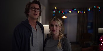 Movie still from “About Fate” (2022), directed by Marius Vaysberg – A man and a woman standing next to each other in a room; Close Up shot, Over the shoulder angle