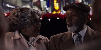 Movie still from “About Fate” (2022), directed by Marius Vaysberg – An older man and a younger woman sitting next to each other; Close Up shot, Over the shoulder angle