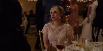 Movie still from “About Fate” (2022), directed by Marius Vaysberg – A woman sitting at a table with a glass of red wine; Close Up shot, Over the shoulder angle