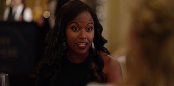 Movie still from “About Fate” (2022), directed by Marius Vaysberg – A person with long black hair; Close Up shot, Over the shoulder angle