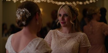 Movie still from “About Fate” (2022), directed by Marius Vaysberg – A woman in a white dress looking at another woman in a white dress; Close Up shot, Over the shoulder angle