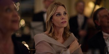 Movie still from “About Fate” (2022), directed by Marius Vaysberg – A person sitting in a chair; Close Up shot, Over the shoulder angle