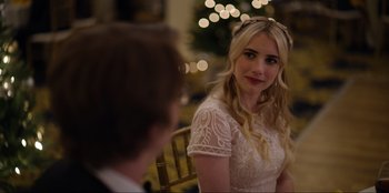 Movie still from “About Fate” (2022), directed by Marius Vaysberg – A beautiful blonde woman in a white dress; Close Up shot, Over the shoulder angle