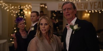 Movie still from “About Fate” (2022), directed by Marius Vaysberg – A man and a woman standing next to each other in formal wear; Close Up shot, Over the shoulder angle