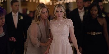 Movie still from “About Fate” (2022), directed by Marius Vaysberg – A woman helping a woman in a dress; Medium shot, Over the shoulder angle