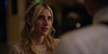 Movie still from “About Fate” (2022), directed by Marius Vaysberg – A beautiful young lady with blonde long hair; Close Up shot, Over the shoulder angle