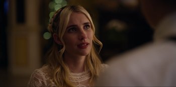 Movie still from “About Fate” (2022), directed by Marius Vaysberg – A beautiful young lady with long blonde hair; Close Up shot, Over the shoulder angle