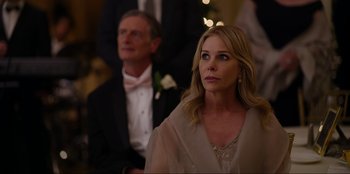 Movie still from “About Fate” (2022), directed by Marius Vaysberg – A man and a woman in formal wear sitting next to each other; Close Up shot, Over the shoulder angle