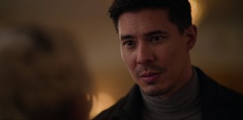 Movie still from “About Fate” (2022), directed by Marius Vaysberg – A person wearing a jacket; Close Up shot, Over the shoulder angle