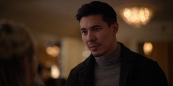 Movie still from “About Fate” (2022), directed by Marius Vaysberg – A person wearing a jacket; Close Up shot, Over the shoulder angle