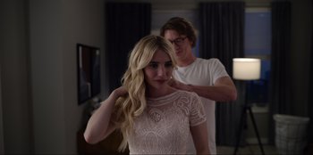 Movie still from “About Fate” (2022), directed by Marius Vaysberg – A man and a woman in a room; Medium shot, Over the shoulder angle