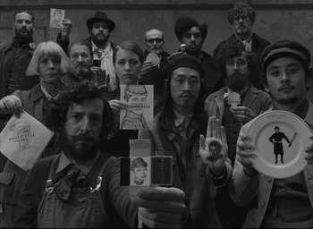 Movie still from “The French Dispatch” (2021), directed by Wes Anderson – Medium shot, High angle