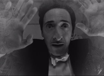 Movie still from “The French Dispatch” (2021), directed by Wes Anderson – Close Up shot, Overhead angle