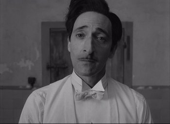 Movie still from “The French Dispatch” (2021), directed by Wes Anderson – Close Up shot, Low angle