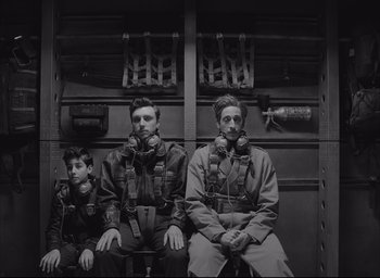 Movie still from “The French Dispatch” (2021), directed by Wes Anderson – Medium shot, Low angle