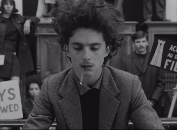 Movie still from “The French Dispatch” (2021), directed by Wes Anderson – Medium shot, Over the shoulder angle