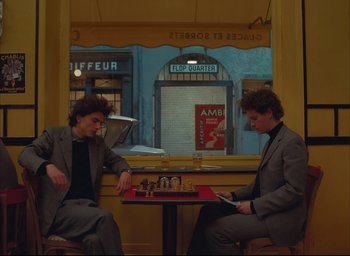 Movie still from “The French Dispatch” (2021), directed by Wes Anderson – Medium shot, High angle