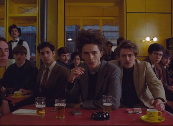 Movie still from “The French Dispatch” (2021), directed by Wes Anderson – Medium shot, Over the shoulder angle