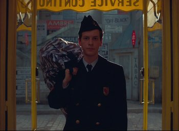 Movie still from “The French Dispatch” (2021), directed by Wes Anderson – Medium shot, High angle