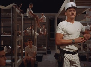 Movie still from “The French Dispatch” (2021), directed by Wes Anderson – Wide shot, Low angle