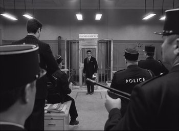 Movie still from “The French Dispatch” (2021), directed by Wes Anderson – Wide shot, Low angle