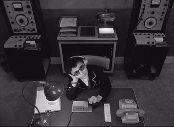 Movie still from “The French Dispatch” (2021), directed by Wes Anderson – Medium shot, High angle