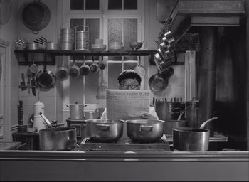 Movie still from “The French Dispatch” (2021), directed by Wes Anderson – Medium shot, High angle