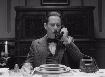 Movie still from “The French Dispatch” (2021), directed by Wes Anderson – Medium shot, High angle