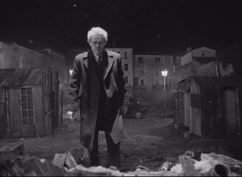 Movie still from “The French Dispatch” (2021), directed by Wes Anderson – Wide shot, Low angle