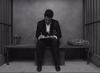 Movie still from “The French Dispatch” (2021), directed by Wes Anderson – Medium shot, High angle