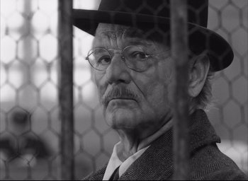 Movie still from “The French Dispatch” (2021), directed by Wes Anderson – Close Up shot, Low angle