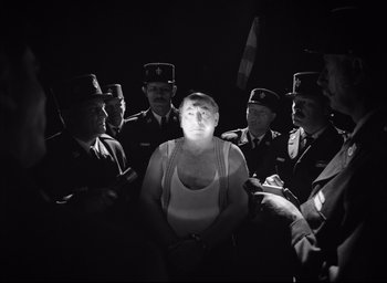 Movie still from “The French Dispatch” (2021), directed by Wes Anderson – Medium shot, Low angle